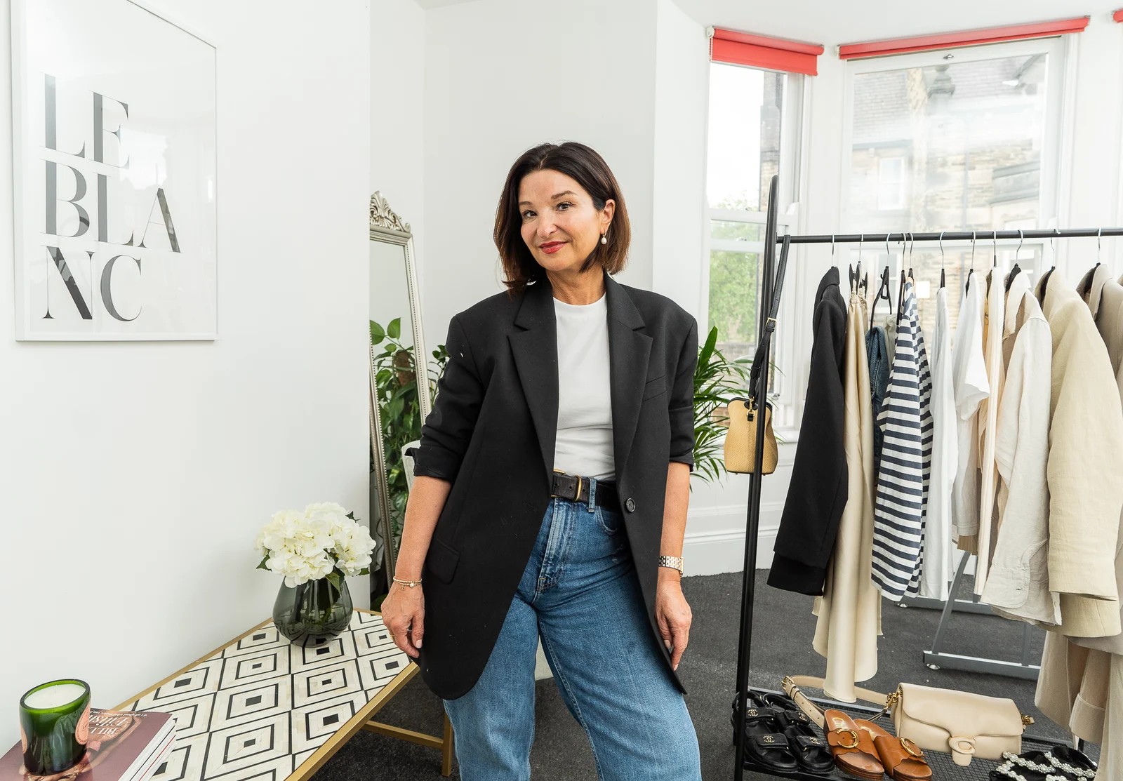 Steph's branding portrait of a business owner in her clothing shop
